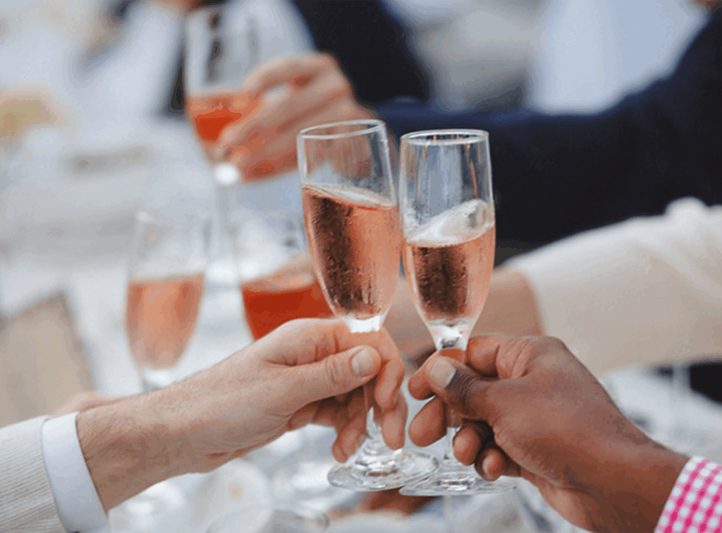 Two hands toasting with champagne